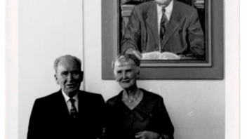 William & Marie Cruess in front of Wm. Cruess's portrait, Cruess Hall
